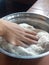 Hand in flour  making arepas