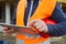 Hand of foreman operates touch screen on computer