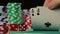 Hand of gambler checking playing cards, person tempting fate in poker game
