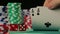 Hand of gambler checking playing cards, person tempting fate in poker game