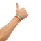 Hand with gay pride rainbow wristband shows thumb