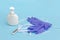Hand gel, thermometer, medical gloves and protective face mask on blue background. Protection of Coronavirus , Covid-19 concept
