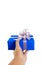 Hand gesture giving a gift wrapped in blue