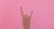 Hand gesturing heavy metal rock sign