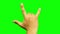 Hand gesturing heavy metal rock sign isolated