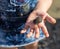 Hand of girl holding cute newborn baby turtle