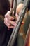 Hand of a girl playing a cello closeup. contrabass
