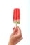 Hand of a girl with a slice of juicy watermelon, fruit ice cream lolly on a white background with a copy space. Dessert