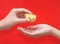 Hand giveing gold ingot for Chinese New Year celebration