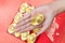 Hand giveing gold ingot for Chinese New Year celebration