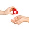 Hand giving heart with red cross symbol