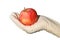 Hand with glove holding apple