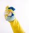 Hand with gloves squeezing sponge