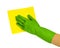 Hand in green glove with yellow rag