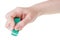 Hand with green new rubber eraser close up