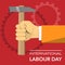 Hand with hammer international labour day