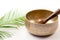 Hand hammered antique tibetan singing bowl with wooden mallet.