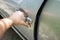 Hand on handle. Close-up of man hand opening a car door