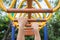 Hand hanging on steel bar for trapeze. Outdoor exercise equipment at public park