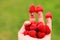 Hand with happy fingers holding Raspberries