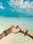 Hand heart on paradise bikini beach Maldives