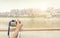 Hand-held camera to shoot the river`s city