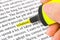 Hand with highlighter and word solution