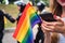 Hand hold a gay lgbt flag at LGBT gay pride parade festival