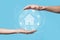 Hand hold house icon.Smart home controlled, intelligent house, and home automation app concept.Pcb design and person with smart