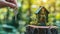 Hand Hold Key with Miniature House Model on a Tree Stump, Eco-Friendly House with Solar Panels and Lush Greenery on its Walls