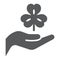 Hand hold lucky clover glyph icon, st patrick`s day and holiday, hand holding clover sign, vector graphics, a solid