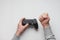 Hand hold new joystick isolated. Gamer play game with gamepad controller. Gaming man holding simulator joypad. Person with keypad