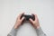 Hand hold new joystick isolated. Gamer play game with gamepad controller. Gaming man holding simulator joypad. Person with keypad