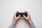 Hand hold new joystick isolated. Gamer play game with gamepad controller. Gaming man holding simulator joypad. Person with keypad