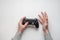 Hand hold new joystick isolated. Gamer play game with gamepad controller. Gaming man holding simulator joypad. Person with keypad