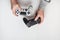 Hand hold new joystick isolated. Gamer play game with gamepad controller. Gaming man holding simulator joypad. Person with keypad