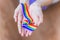 Hand hold a rainbow of LGBT tapes on a LIGHT background. Copy space The concept of homosexuals and LGBT people.