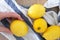 Hand hold raw fresh yellow wet lemon on towel. Washing organic citrus fruits