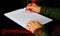 Hand hold red pen correct English grammar