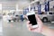 Hand hold smartphone with car repair service centre