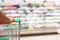 Hand hold supermarket shopping cart with Abstract grocery store