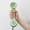 Hand hold vintage telephone green color