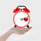 Hand holding the alarm clock. Valentine s Day