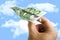 Hand Holding Banknote Paper Plane in making money and financial