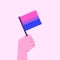 Hand holding bisexual flag. Pride month concept