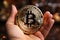 Hand holding bitcoin crypto coin cryptocurrency digital money investment golden blockchain symbol virtual cash exchange