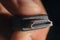 Hand holding black HDMI cable. Man\'s hand holds a HDMI Connector. Closeup HDMI cable.