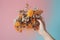 Hand holding a bouquet of honeycombs and bees. created with Generative AI technology
