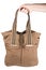 Hand holding brown canvas purse