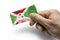 Hand holding a card with a national flag the Burundi